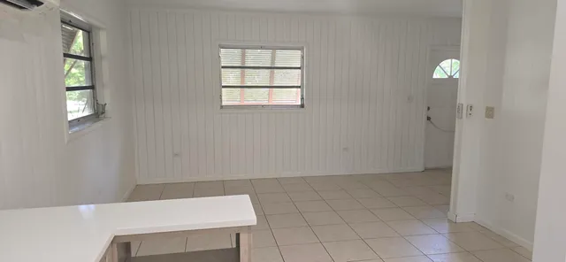 a view of kitchen with furniture and window