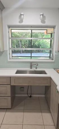a view of hallway with cabinets