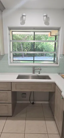 a view of hallway with cabinets