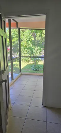 a bathroom with a shower and toilet