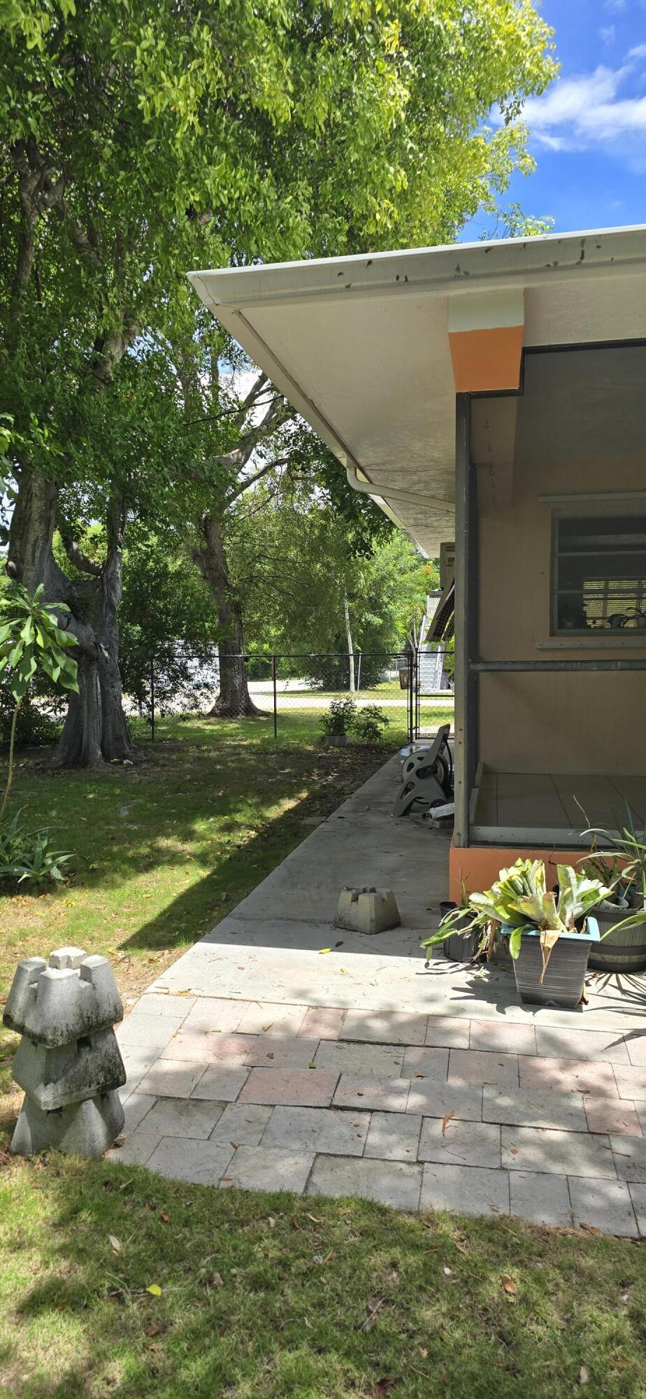16 Pompano Avenue Key Largo, FL 33037 - Photo 3 of 23 a view of a yard with an outdoor space