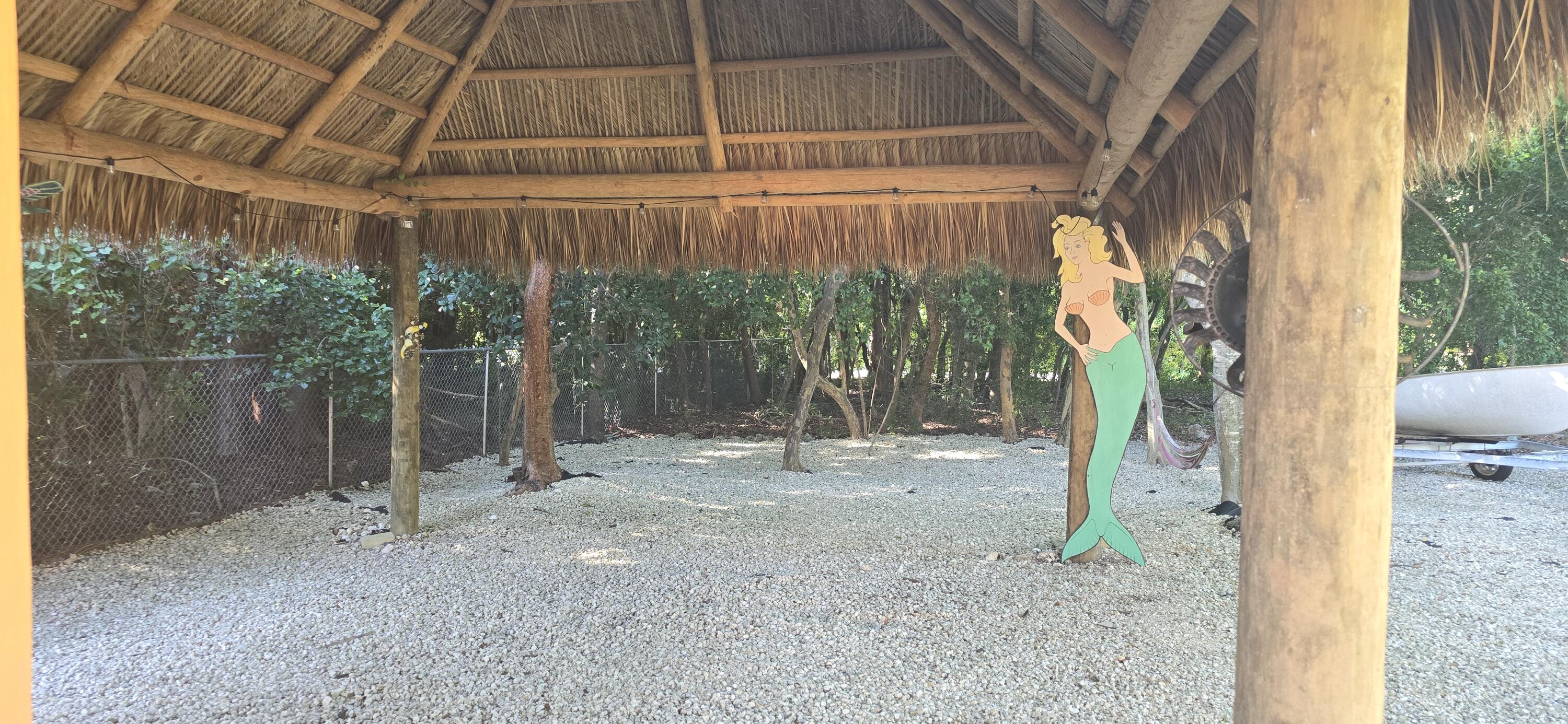 16 Pompano Avenue Key Largo, FL 33037 - Photo 6 of 23 a backyard of a house with lots of green space