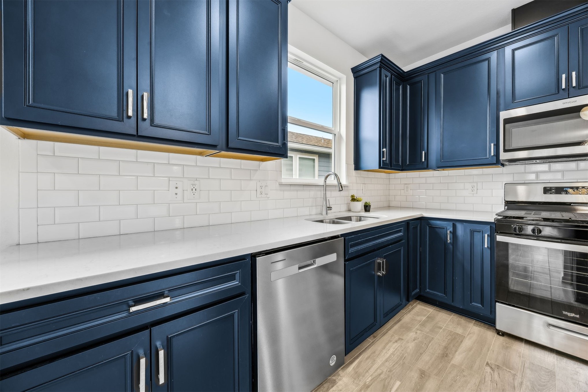 540 Jubilee Circle Yulee, FL 32097 - Photo 5 of 42 a kitchen with stainless steel appliances granite countertop wooden cabinets a sink and dishwasher