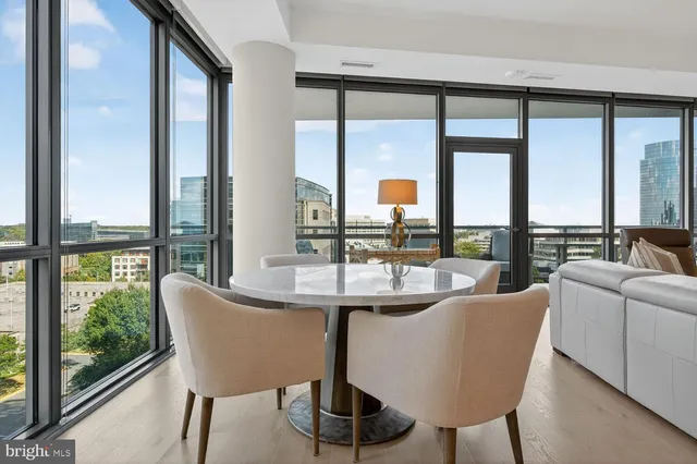 a kitchen with stainless steel appliances a sink and a refrigerator