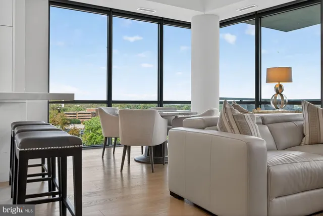 a large kitchen with stainless steel appliances granite countertop a stove and a sink
