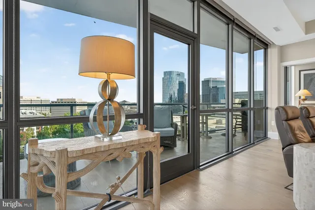 a bedroom with a bed and painting on the wall