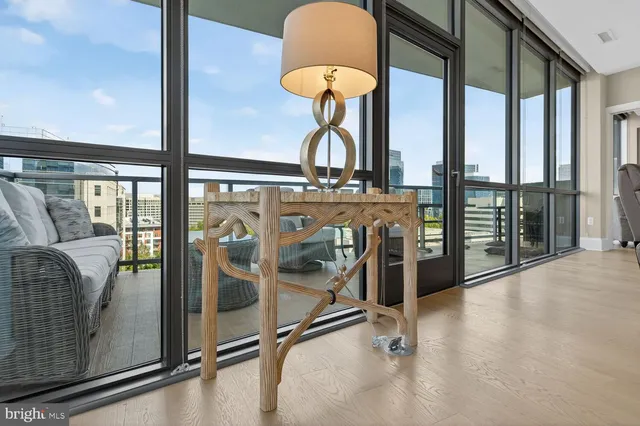 a bedroom with a bed and a lamp on dresser