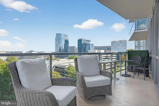 a large bed sitting in a bedroom next to a lamp and a lamp