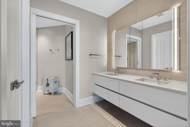a view of a patio with table and chairs potted plants and a large tree