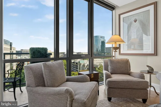 a view of a patio with couches and a fire pit