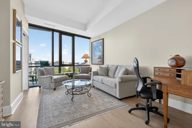 a view of swimming pool with outdoor seating and plants