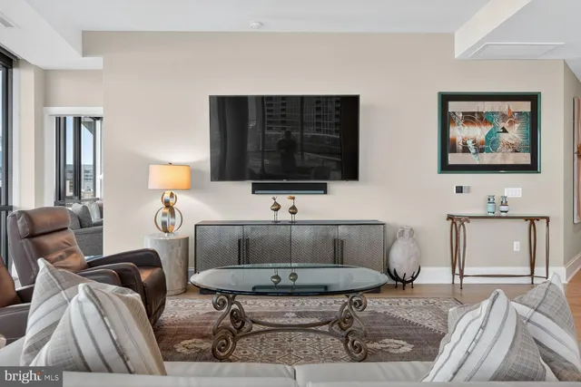 a living room with furniture and a flat screen tv