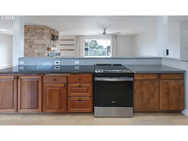 a kitchen with a stove and a cabinets