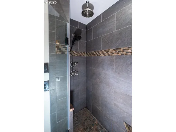 a bathroom with a shower and a sink