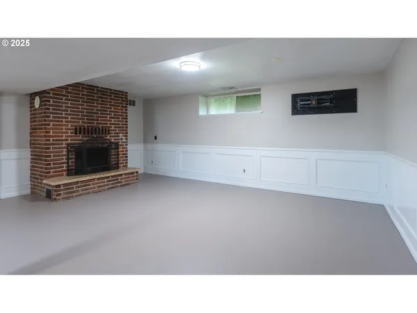 a bathroom with a granite countertop sink a toilet and a mirror