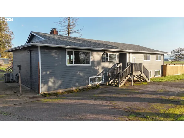 a front view of a house with yard