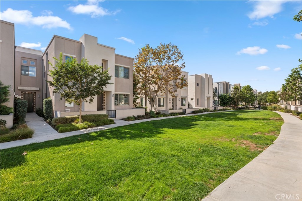 157 Terrapin Irvine, CA 92618 - Photo 1 of 19 a view of a multi story residential apartment building with a yard
