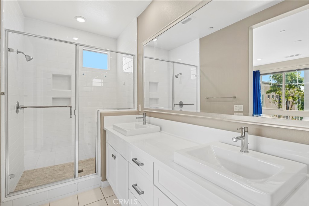 157 Terrapin Irvine, CA 92618 - Photo 11 of 19 a bathroom with double vanity sink and mirror