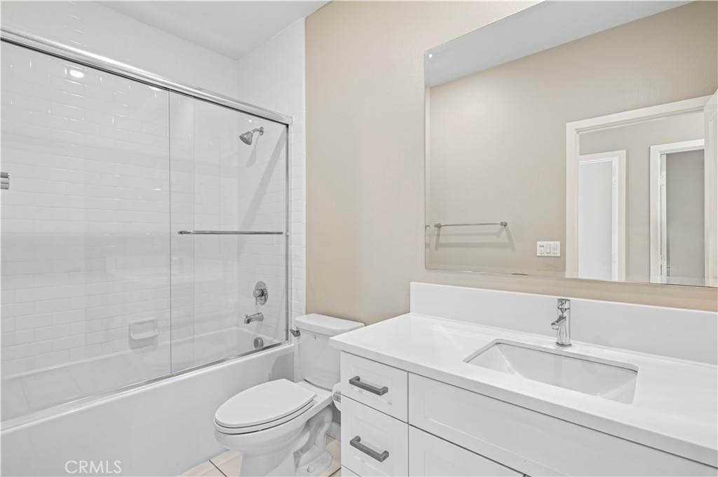 157 Terrapin Irvine, CA 92618 - Photo 14 of 19 a bathroom with a sink a toilet and a large mirror