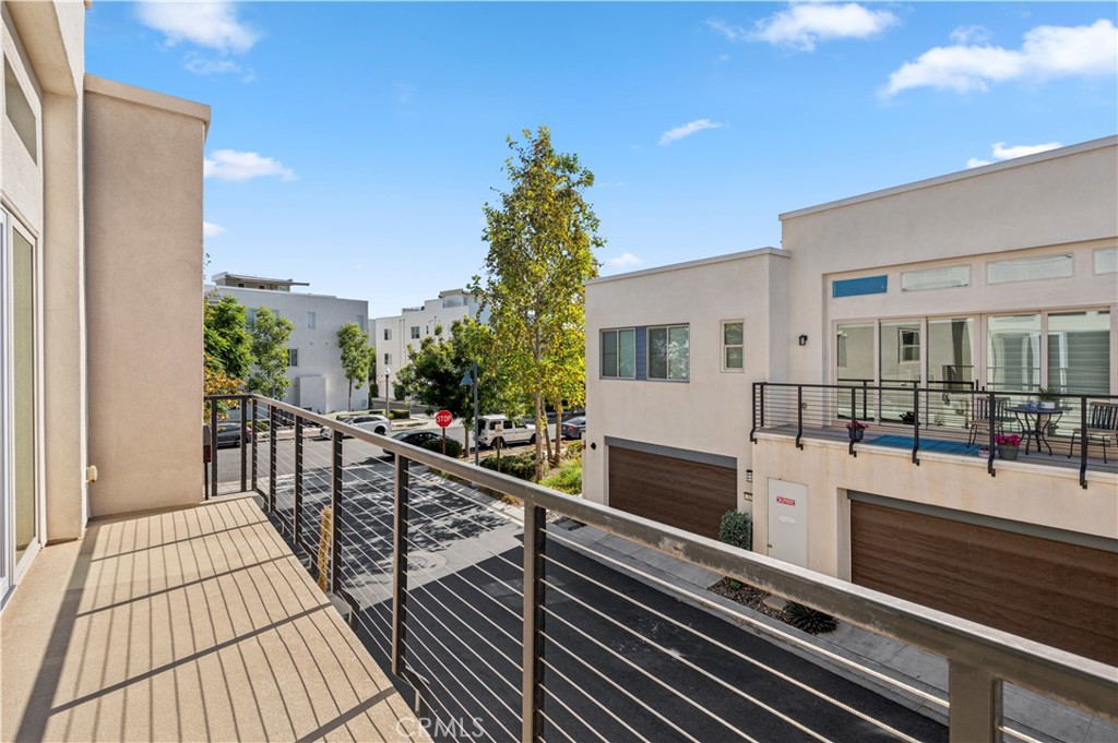 157 Terrapin Irvine, CA 92618 - Photo 18 of 19 a view of balcony with wooden floor and fence