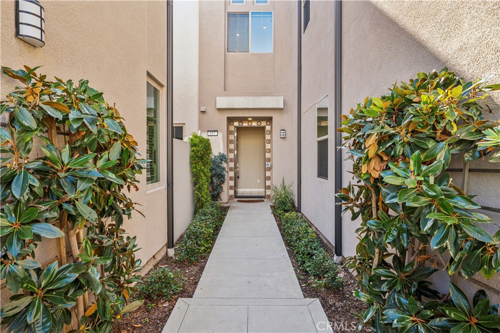 157 Terrapin Irvine, CA 92618 - Photo 2 of 19 a entryway with flower plants