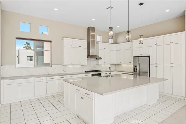 a big room with wooden floor and windows