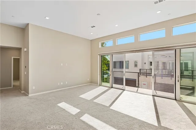 a kitchen with stainless steel appliances granite countertop a sink a counter space and a window