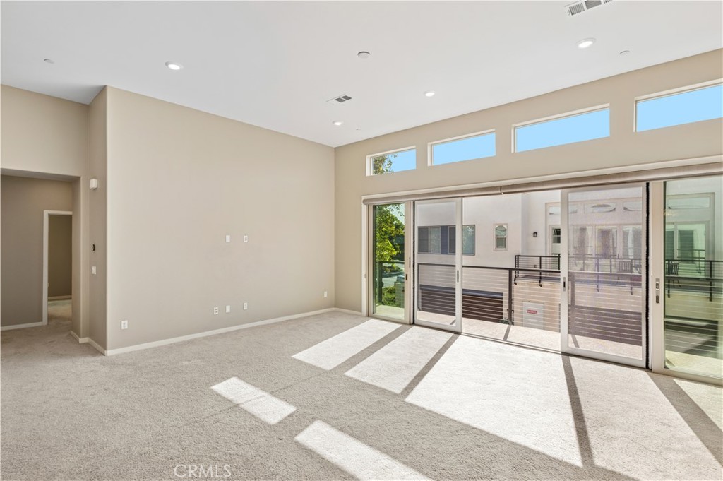 157 Terrapin Irvine, CA 92618 - Photo 8 of 19 a big room with wooden floor and windows