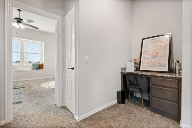 a room that has a dresser and a mirror in it