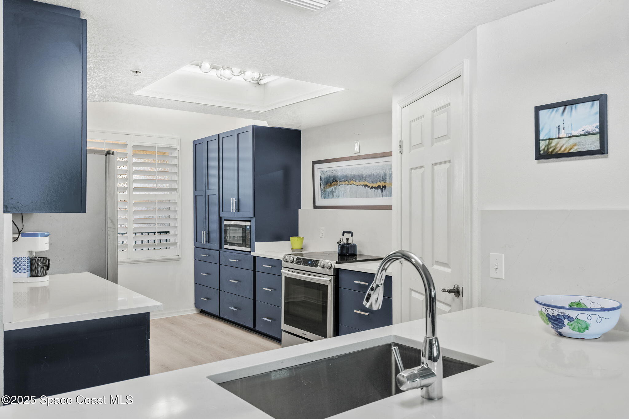 100 Riverside Drive, Unit 405 Cocoa, FL 32922 - Photo 11 of 90 a view of kitchen with stainless steel appliances kitchen island a sink dishwasher stove and refrigerator
