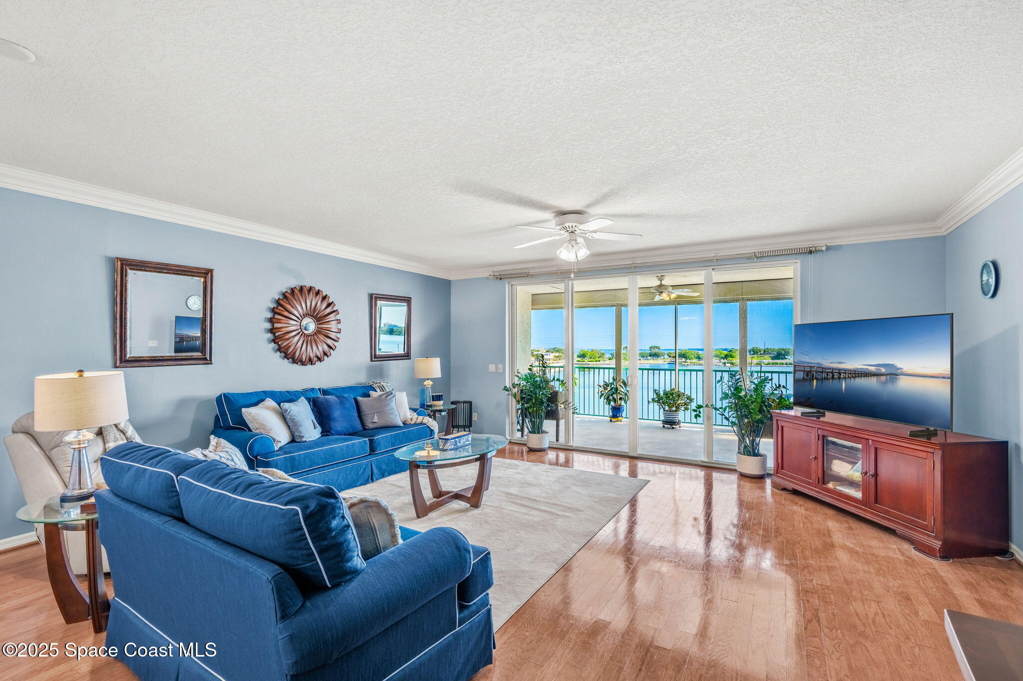 100 Riverside Drive, Unit 405 Cocoa, FL 32922 - Photo 13 of 90 a living room with furniture and a large window