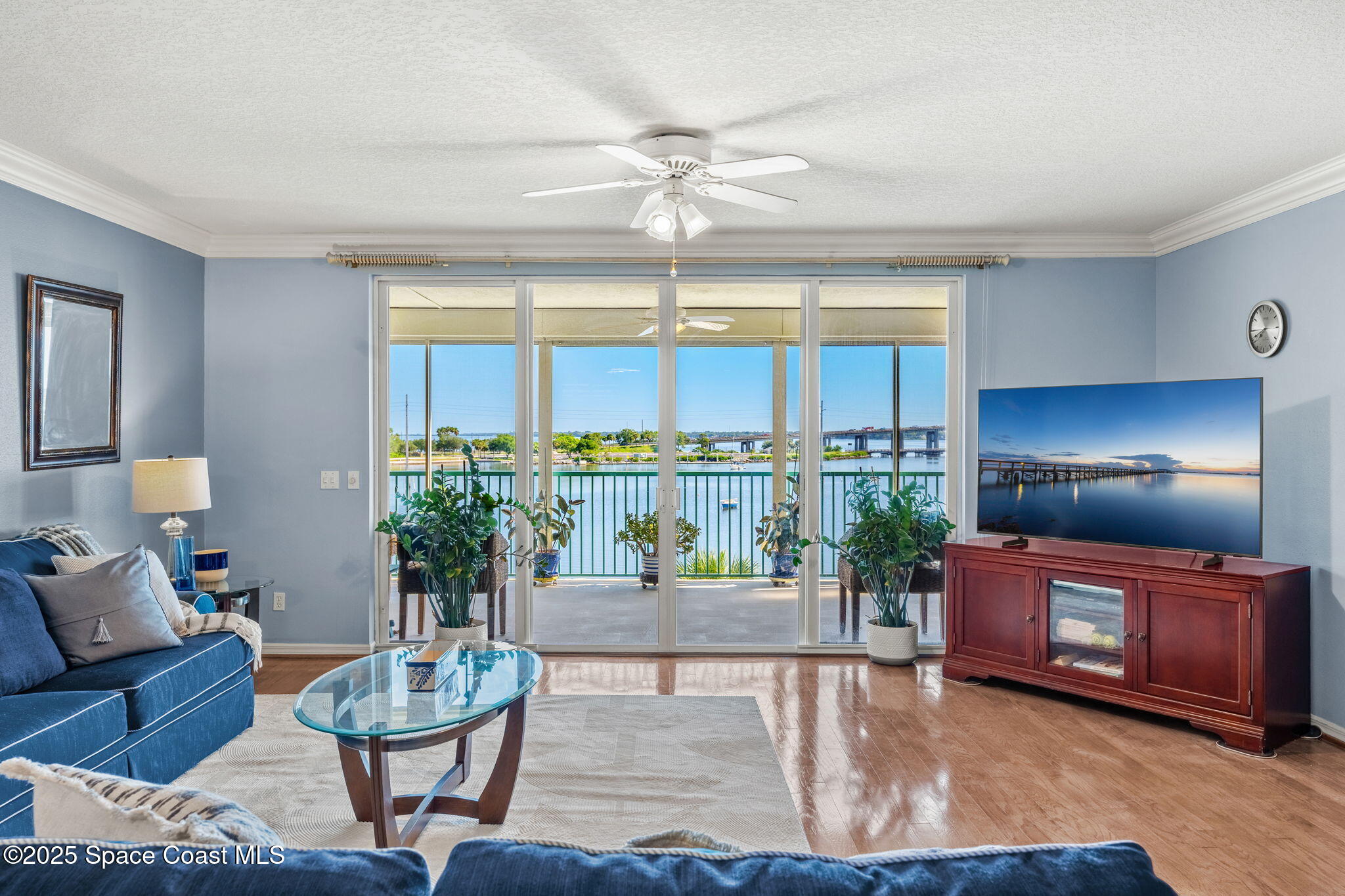 100 Riverside Drive, Unit 405 Cocoa, FL 32922 - Photo 16 of 90 a living room with furniture and a chandelier