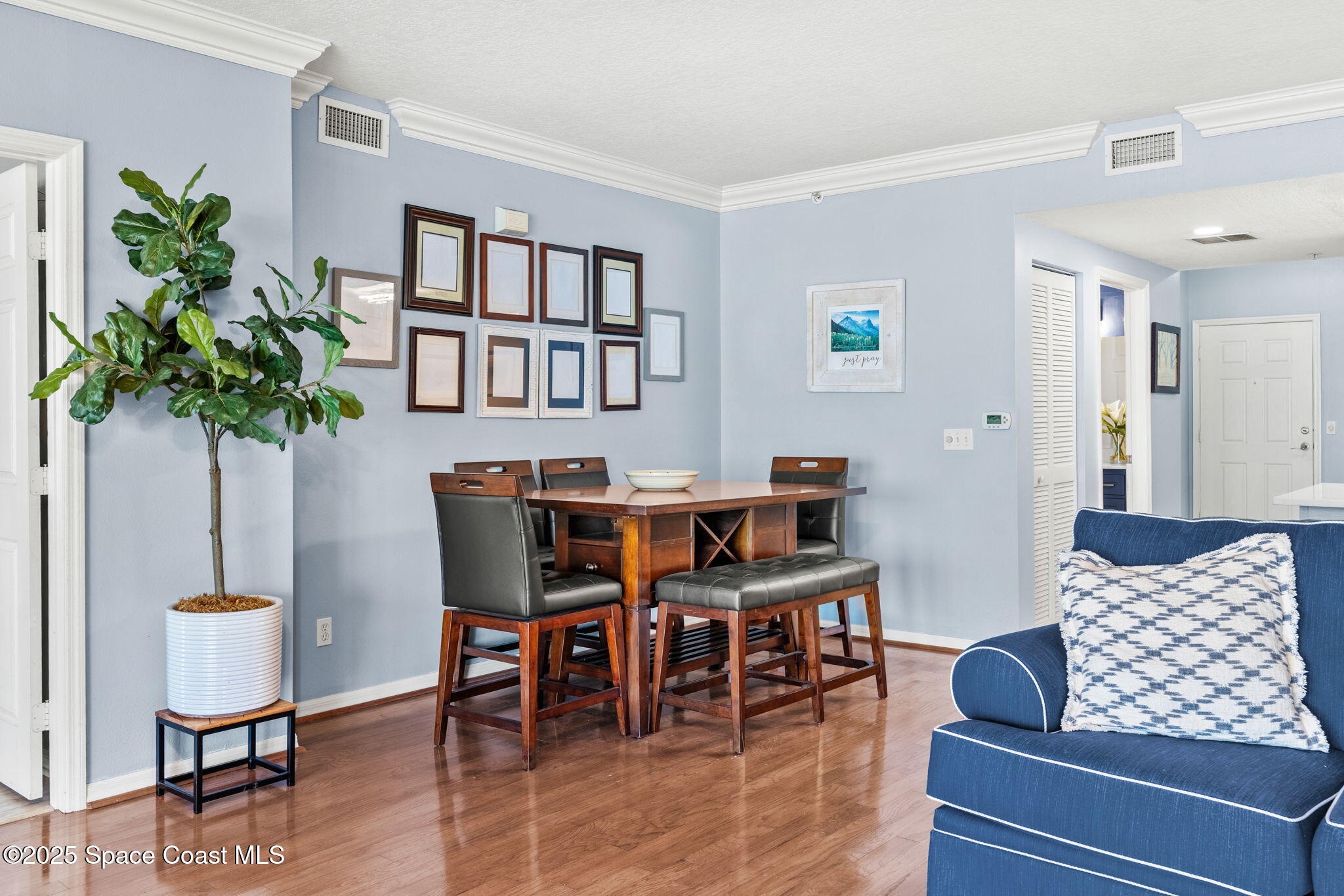 100 Riverside Drive, Unit 405 Cocoa, FL 32922 - Photo 18 of 90 a living room with furniture and a potted plant