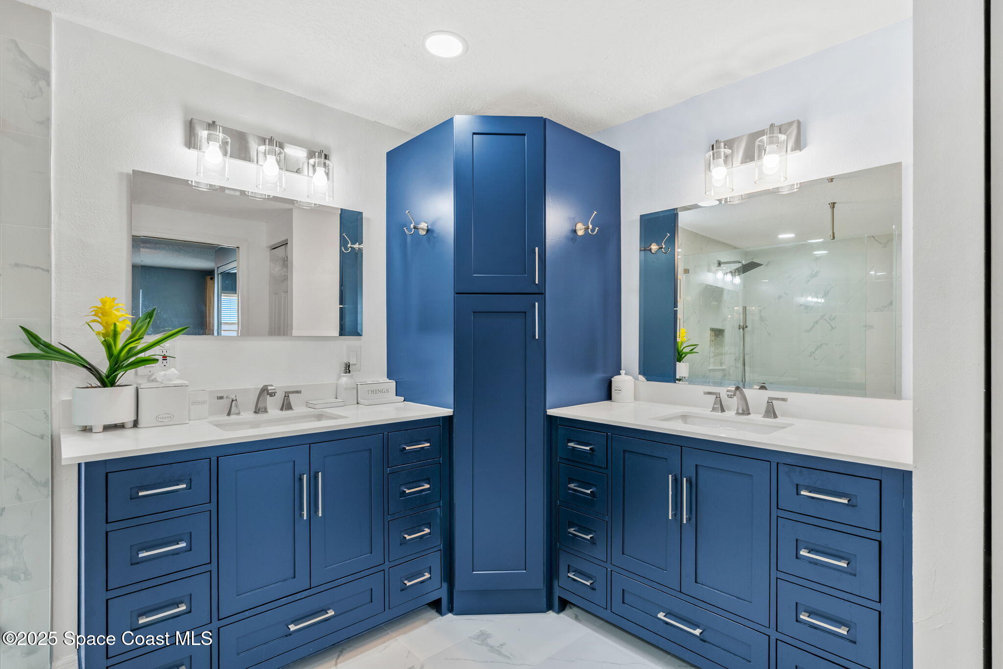 100 Riverside Drive, Unit 405 Cocoa, FL 32922 - Photo 25 of 90 a bathroom with a granite countertop double vanity sink mirror and double