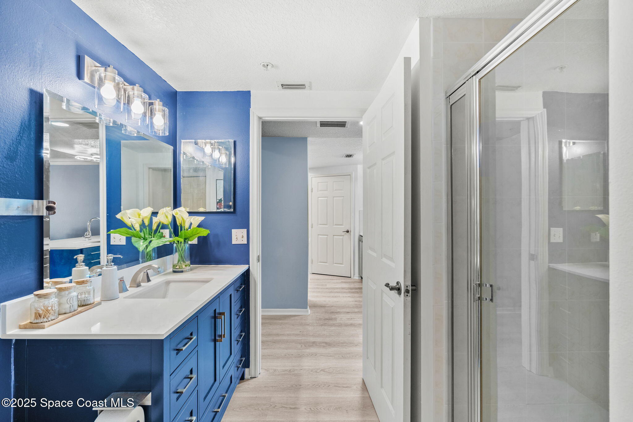 100 Riverside Drive, Unit 405 Cocoa, FL 32922 - Photo 29 of 90 a bathroom with a sink double vanity and a mirror