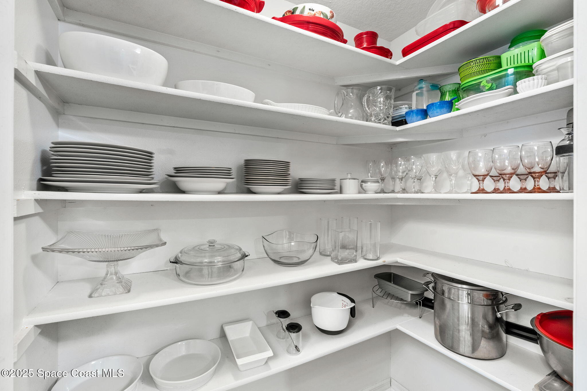 100 Riverside Drive, Unit 405 Cocoa, FL 32922 - Photo 10 of 90 a kitchen with a sink a stove and cabinets