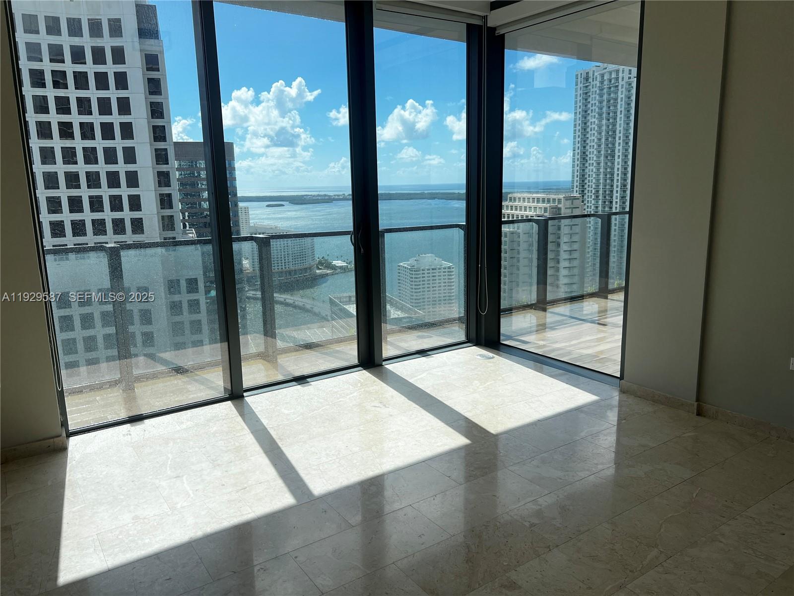 68 Southeast 6th Street, Unit 3401 Miami, FL 33131 - Photo 17 of 23 a view of a glass door with porch