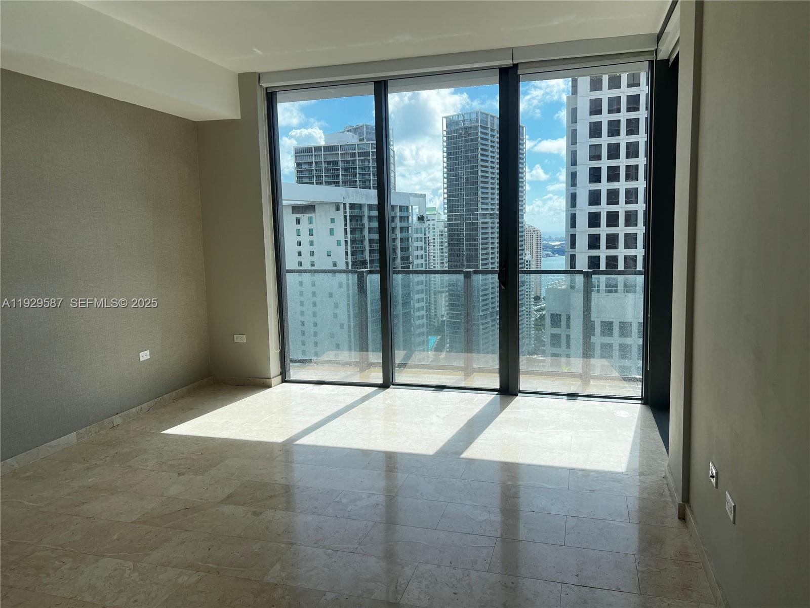 68 Southeast 6th Street, Unit 3401 Miami, FL 33131 - Photo 18 of 23 a swimming pool with glass walls