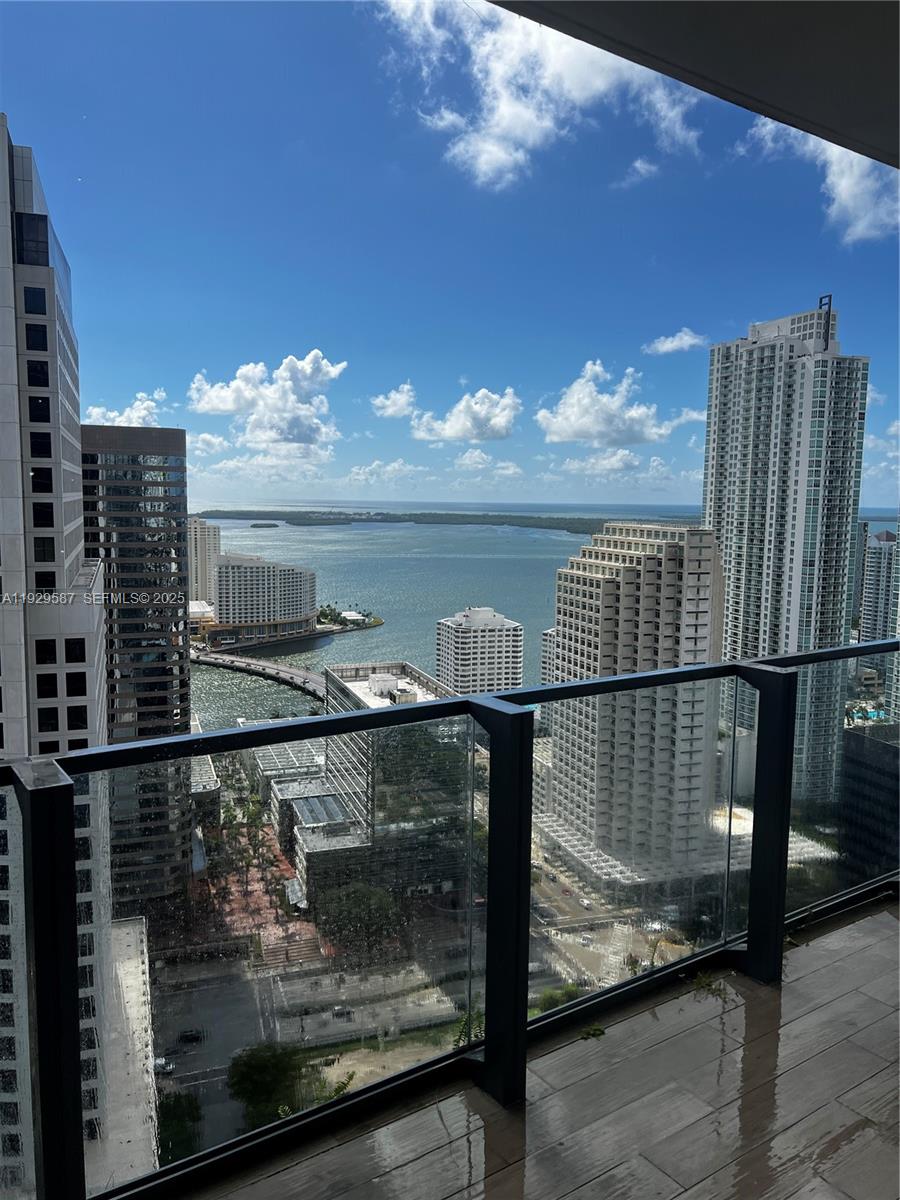 68 Southeast 6th Street, Unit 3401 Miami, FL 33131 - Photo 19 of 23 a view of a balcony with an outdoor space