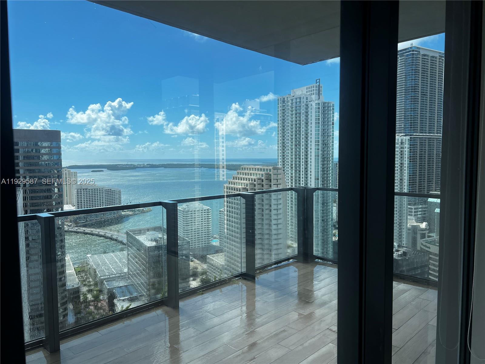 68 Southeast 6th Street, Unit 3401 Miami, FL 33131 - Photo 20 of 23 a view of a glass door with a balcony