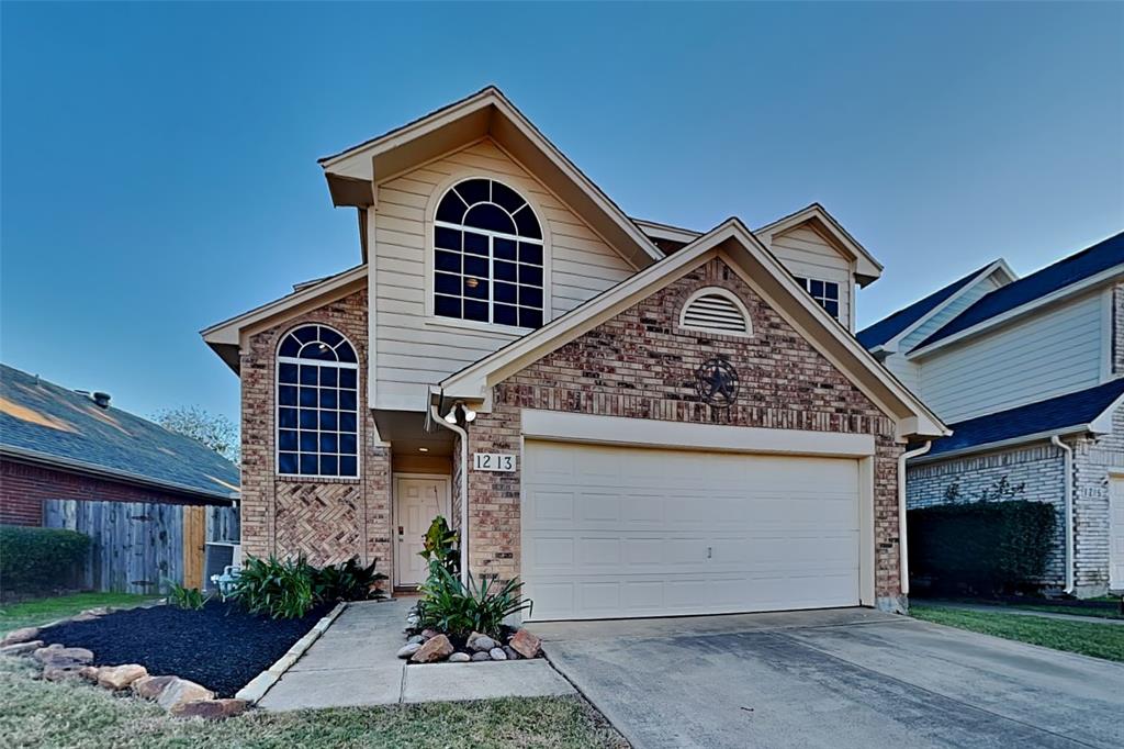 1213 Broken Arrow Trail Carrollton, TX 75007 - Photo 1 of 19 a front view of a house with a yard
