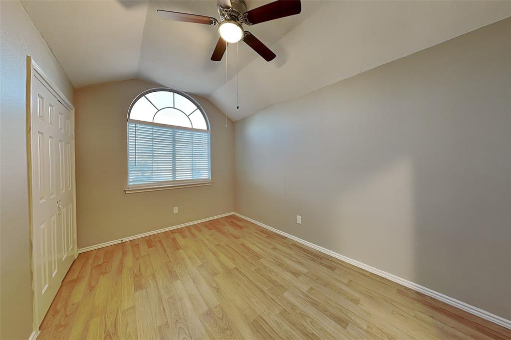 1213 Broken Arrow Trail Carrollton, TX 75007 - Photo 10 of 19 wooden floor in an empty room with a window