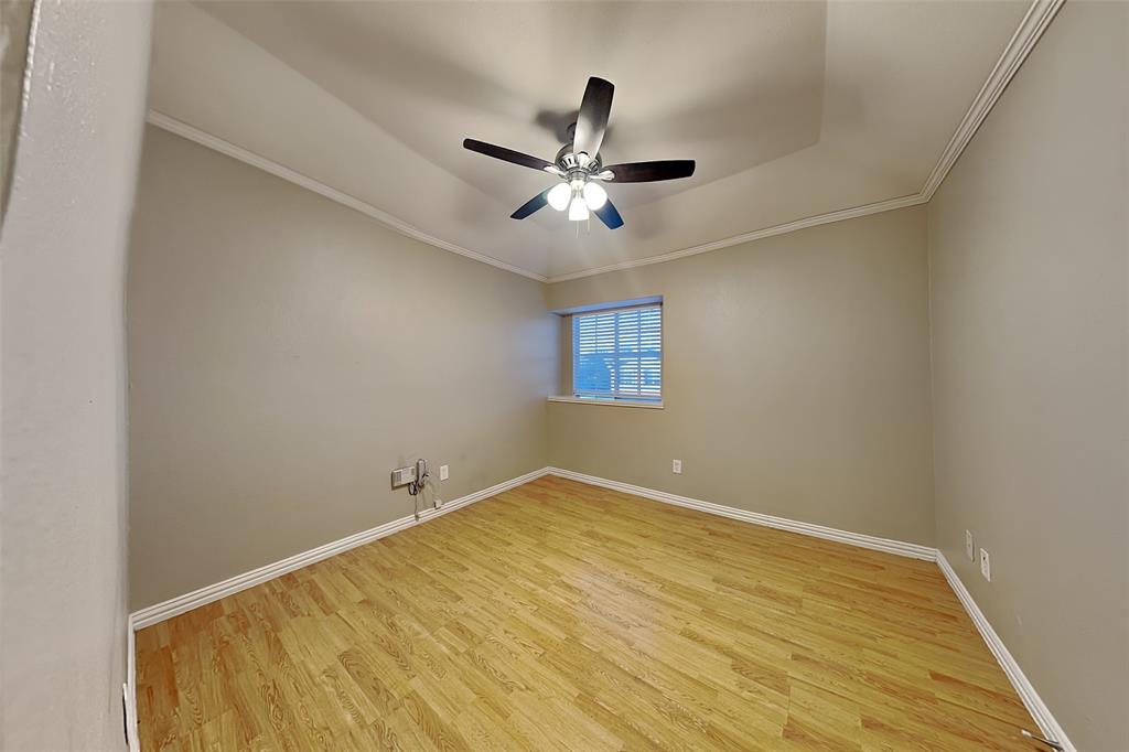 1213 Broken Arrow Trail Carrollton, TX 75007 - Photo 13 of 19 an empty room with a window and a ceiling fan