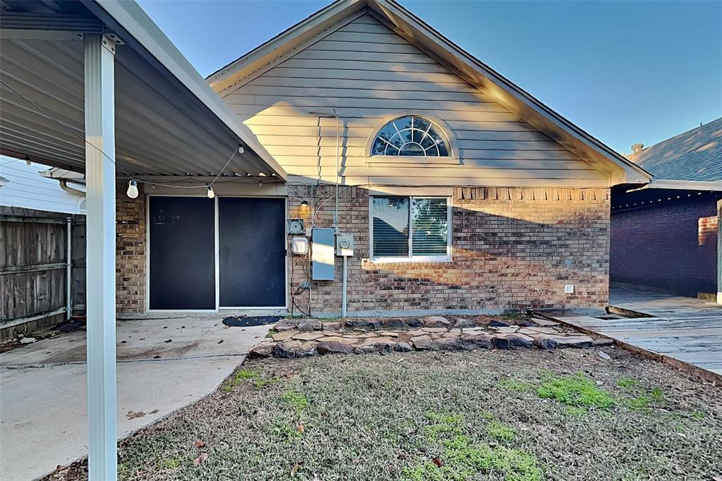 1213 Broken Arrow Trail Carrollton, TX 75007 - Photo 16 of 19 a view of house with backyard of the house