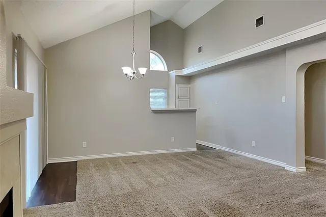 a open kitchen with a sink and wooden floor