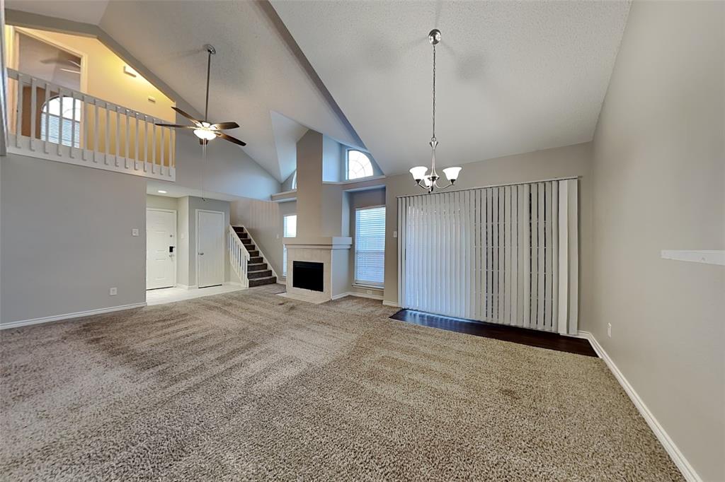 1213 Broken Arrow Trail Carrollton, TX 75007 - Photo 5 of 19 a view of an empty room with kitchen and a window