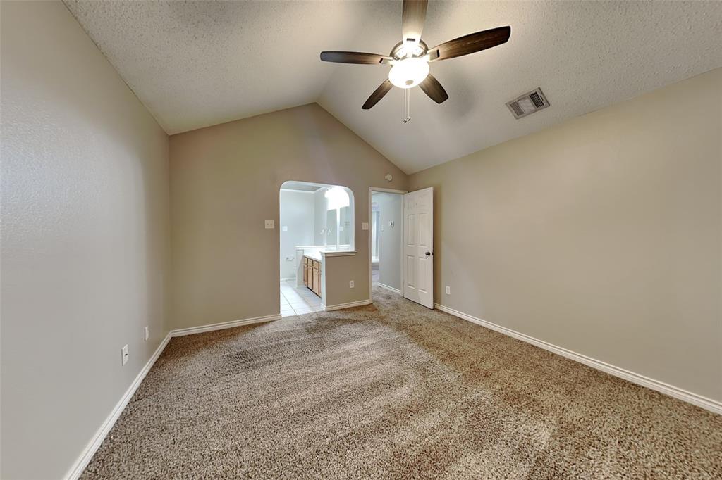 1213 Broken Arrow Trail Carrollton, TX 75007 - Photo 7 of 19 a view of an empty room and a ceiling fan
