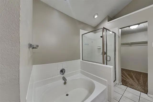 a view of an empty room and a ceiling fan