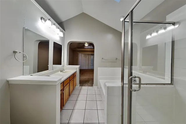 a bathroom with a bathtub and a shower