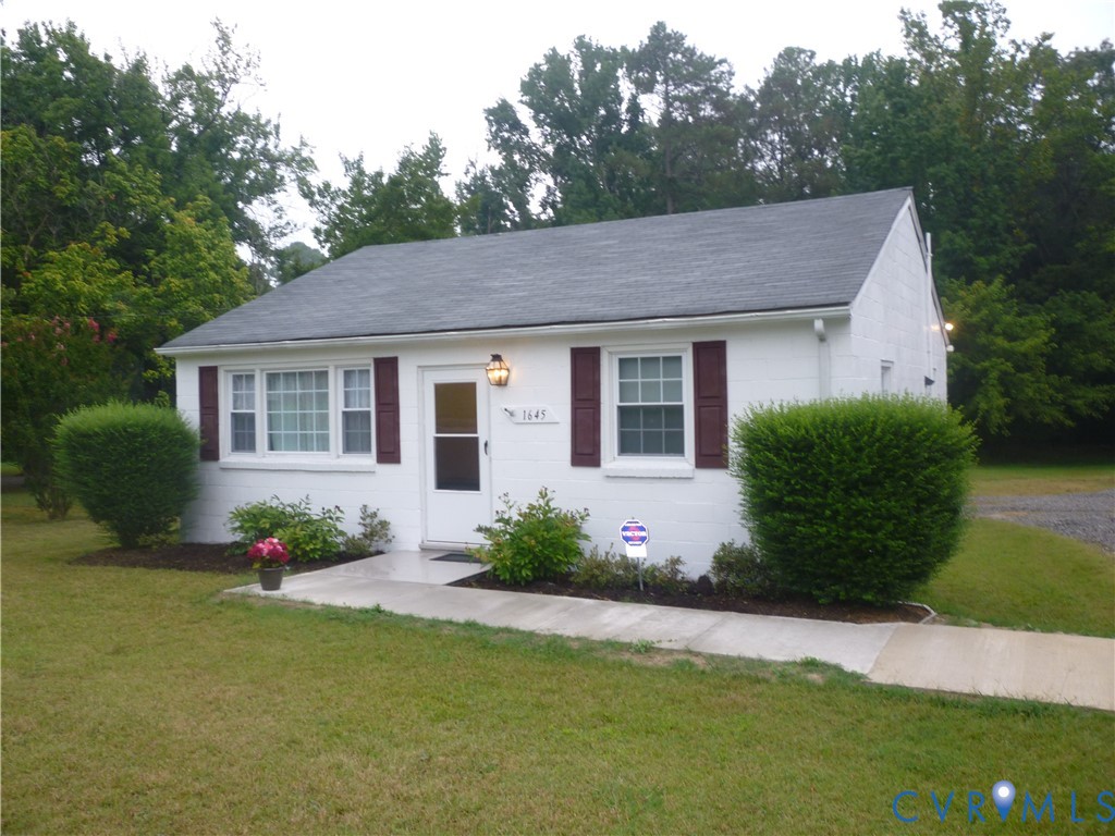 1645 Manakin Road Manakin-Sabot, VA 23103 - Photo 1 of 6 White painted brick exterior with a gray asphalt s